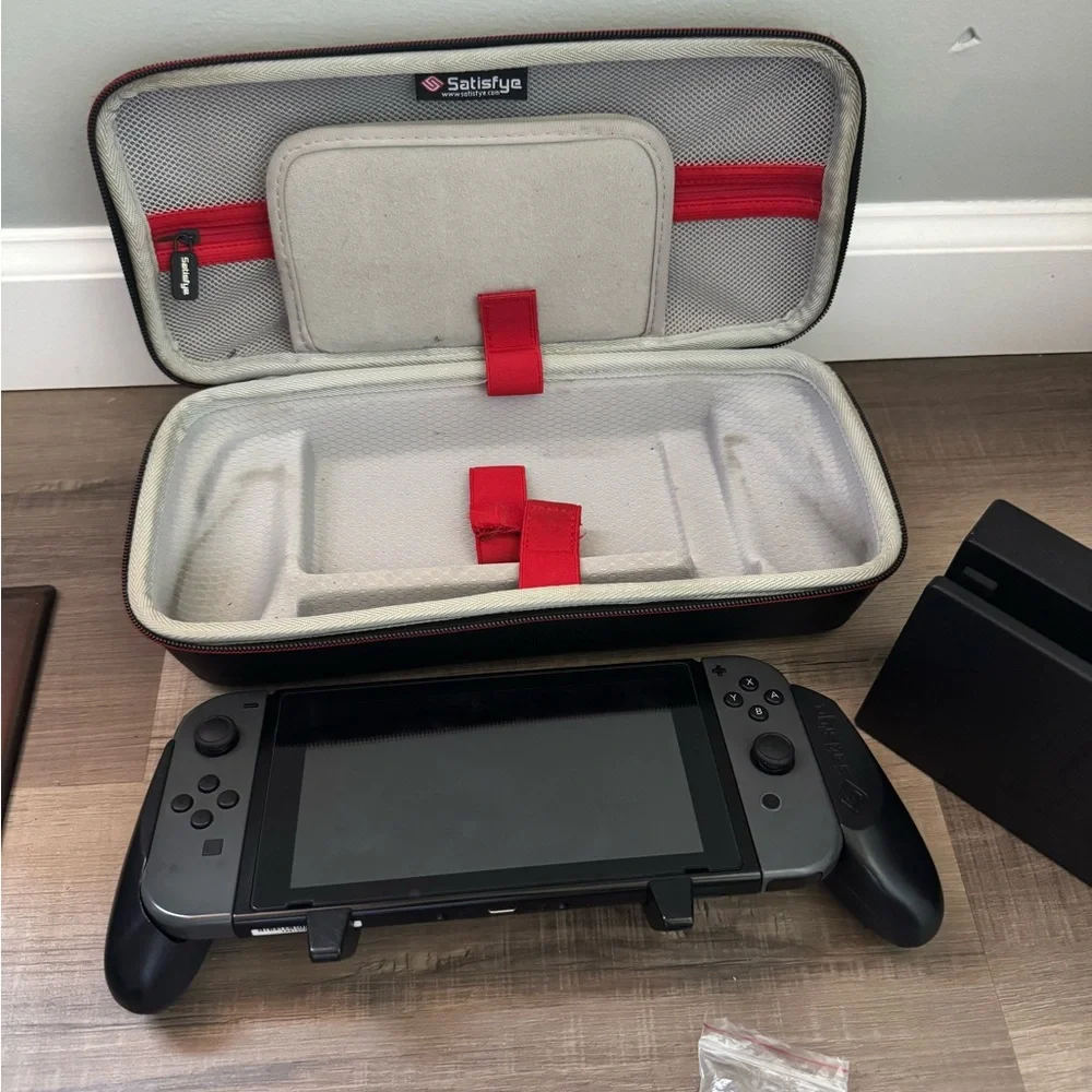 Nintendo Switch with Black and Gray Accessories